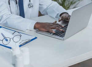 doctor working with laptop
