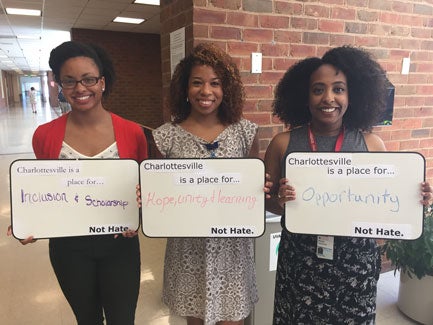 Three woman standing outside UVA Health Sciences Library