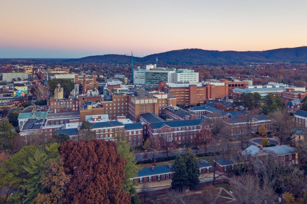 Arial photo showing Charlottesville skyline and UVA hospital