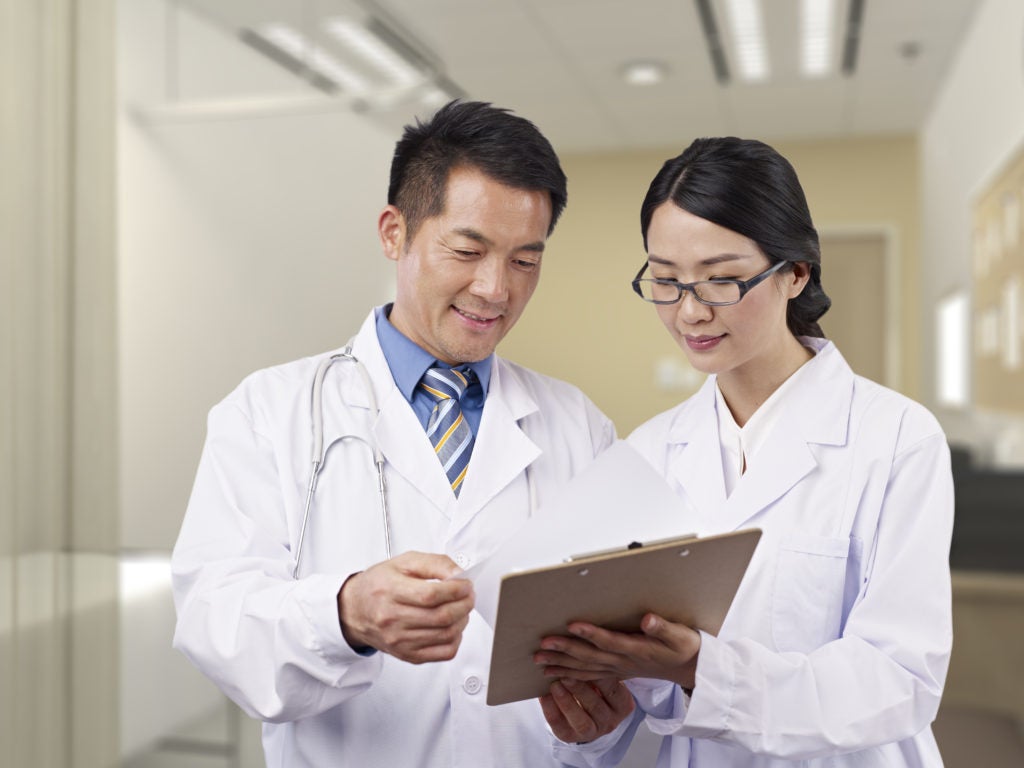 Photo showing two medical professionals talking