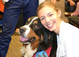 UVA medical student hugging dog