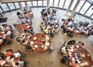 overhead view of students working at round tables