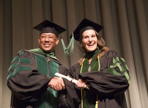 Getting the diploma, and a handshake, from Dean Wilkes.