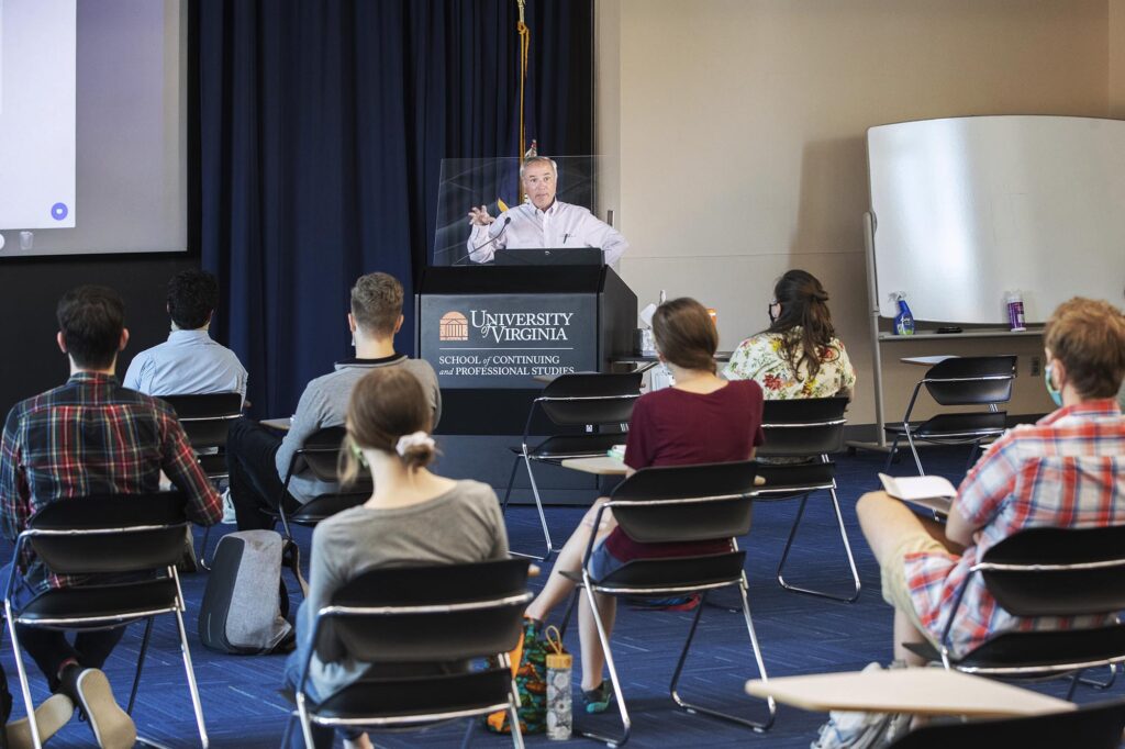 Cohort members attend a weekly seminar, taught by Dr. Robert Powers, on U.S. health care.