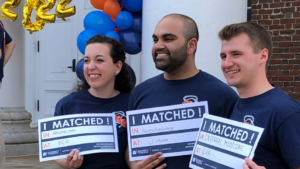UVA School of Medicine, MD Program Match Day Celebrations 2022 group showing match results cards