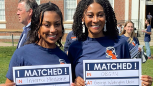 UVA School of Medicine, MD Program Match Day Celebrations 2022 friends showing match results cards