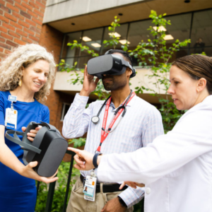 Dr. Kathryn Mutter, Kevin Livingston, and Dr. Margaret Sande with virtual reality 