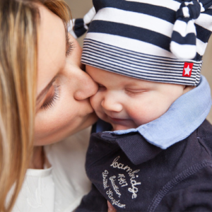 Mother kissing a baby