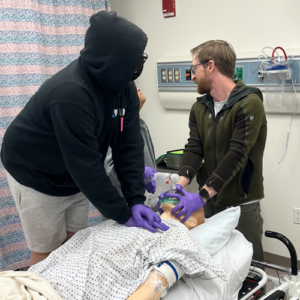 two students in sim center Starr Hill Pathways