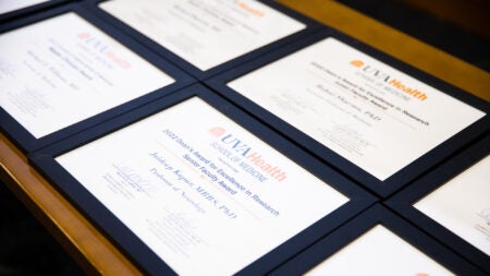 framed diplomas on a table