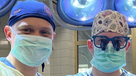 Connor Berlin (right) and fellow surgeon