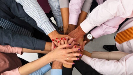 Hands in a circle supporting each other