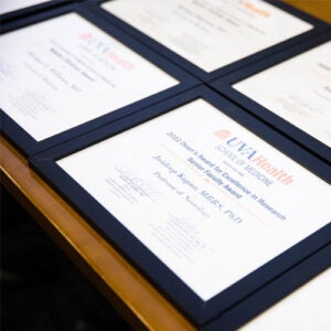 framed diplomas on a table