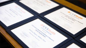 framed diplomas on a table