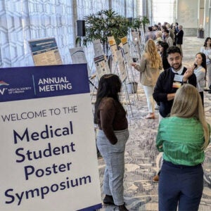 UVA medical student Ishaan Rischie presenting his poster