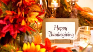 Thanksgiving flowers, candles and message