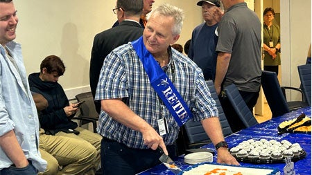 Bruce Shifflett serving up his retirement cake.