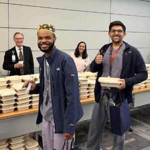 2025 Residents picking up a free lunch.