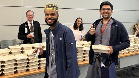 Residents picking up a free lunch.