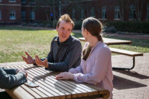 researchers at picnic tables