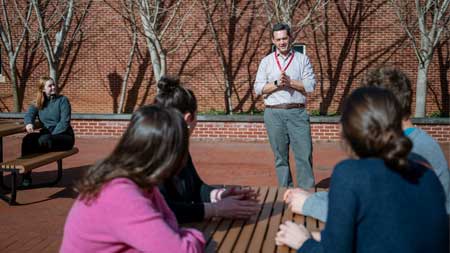 researchers at picnic tables