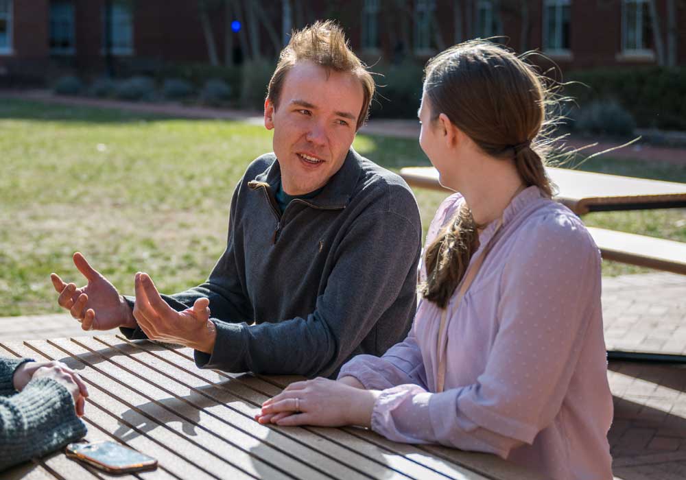 researchers at picnic tables