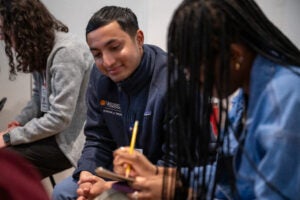 students sitting and drawing