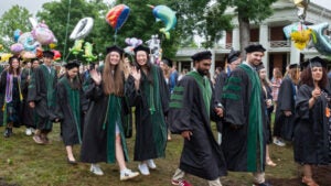 SOM students walk the Lawn in 2024
