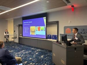 2015 alumnus Scott Yang, MD, debates his mentor Mark Abel, MD, on surgery for scoliosis