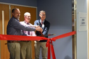 UVA Radiology’s Rich Hooper; James Carnes; and Colin Derdeyn, MD, at the ribbon cutting ceremony celebrating the new MRI suite expansion at University Medical Center.