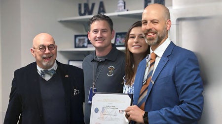 (From left) Chuck Boles, MA, Professor of Justice Studies, Department of Defense ESGR Ombudsman; Brendan Byrne, MD, Department of Emergency Medicine (nominating faculty member, Captain, Medical Core, US Navy Reserves); Anna Beth Muck (daughter of Dr. Muck); and Andrew E. Muck, MD, MBA, (Professor and Chair, Department of Emergency Medicine, Air Force Veteran)