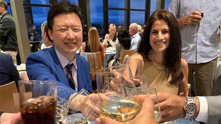 Orthopaedic Alumni Conf 2025 toast with glasses