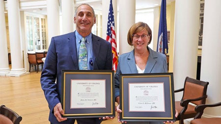 Mohan M. Nadkarni, MD, left, and Collen McNamara, MD, show their Thomas Jefferson Awards.