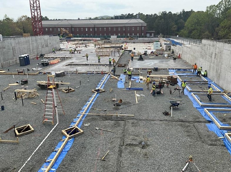 Concrete slab pours followed closely behind plumbing work and inspections throughout the month of April. (Photo by Skanska USA, Inc.)