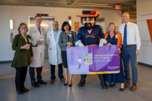 UVA leaders celebrate with CavMan UVA Health Children's #1 2025