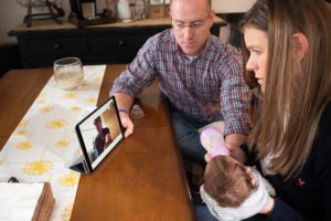 new parents use their ipad at home to meet with doctors at UVA.