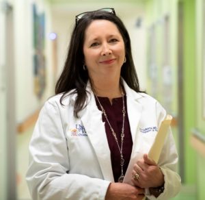 Headshot of Ann Kellams in the hallways of Pediatrics 