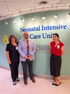Naomi, Pete, and Angee in front of the NICU entrance
