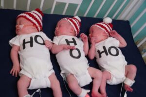 NICU triplets in Ho, Ho, Ho onsies 