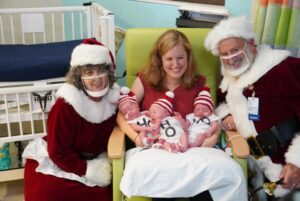Santa and Mrs. Claus with triplets and mom