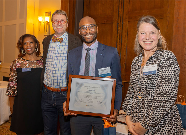 Dr. Taison Bell at the UVA Office of Engagement ceremony being celebrated as a Distinguished Scholar Nov 1, 2023